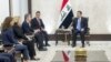 In this photo released by the Iraqi Prime Minister's Media Office, Prime Minister Mohammed Shia al-Sudani, right, meets with U.S. Secretary of State Antony Blinken, third from left, in Baghdad on Dec. 13, 2024.