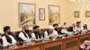 FILE - Mullah Abdul Ghani Baradar (3rd-L), who is leading a Taliban delegation, attends a meeting at the Ministry of Foreign Affairs in Islamabad, Pakistan, Oct. 3, 2019.