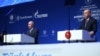Turkish President Recep Tayyip Erdogan, right, and Russian President Vladimir Putin speak during a ceremony for the dual natural gas line, TurkStream, connecting their countries, in Istanbul, Jan. 8, 2020. 