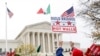 People rally outside the Supreme Court, Nov. 12, 2019, in Washington.