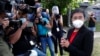 FILE - Rappler CEO Maria Ressa stands in front of reporters outside the Court of Tax Appeals in Manila, Philippines, March 4, 2021. She testified in response to four counts of tax evasion and failure to file accurate tax returns. 