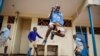 Schoolchildren joke around and play at the Olympic Primary School in Kibera, one of the capital Nairobi's poorest areas, in Kenya, Oct. 12, 2020. 