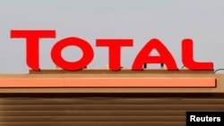 The logo of French oil giant Total is pictured at a petrol station in Laplume, France, Jan. 16, 2020. 