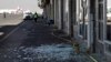 Workers walk past broken glass in Sanaa International Airport following Thursday's Israeli airstrikes on Yemen, Dec. 27, 2024. 
