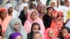 Nigeria Muslim women and children attend Eid al-Adha prayers to mark the end of the holy month of Hajji in Lagos, Nigeria, Oct. 15, 2013. 