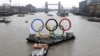 Backdropped by the historic Tower Bridge, a giant Olympic Rings floats on the River Thames in London in the run-up for the Olympic games, during its launch to mark 150-days until the start of the London 2012 Olympic games, February 28, 2012. 