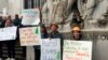Protesters converge outside the Oregon Capitol in Salem, Ore., June 27, 2019. Truckers, loggers and farmers say they support the 11 Republican senators who walked out over a week ago to avoid a vote on climate legislation.