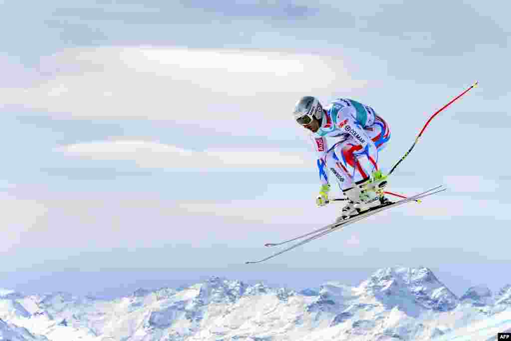 France&#39;s Adrien Theaux jumps during the men&#39;s downhill practice at the FIS Alpine Skiing World Cup finals in St. Moritz, Switzerland.