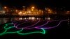 An illumination in the shape of a lotus, party symbol of the winning Bharatiya Janata Party, illuminates the River Ganges in Varanasi, in the northern Indian state of Uttar Pradesh, May 16, 2014.