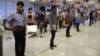 Indian students line up at American Embassy in New Delhi for student visas, June 19, 2014. (Anjana Pasricha/VOA)