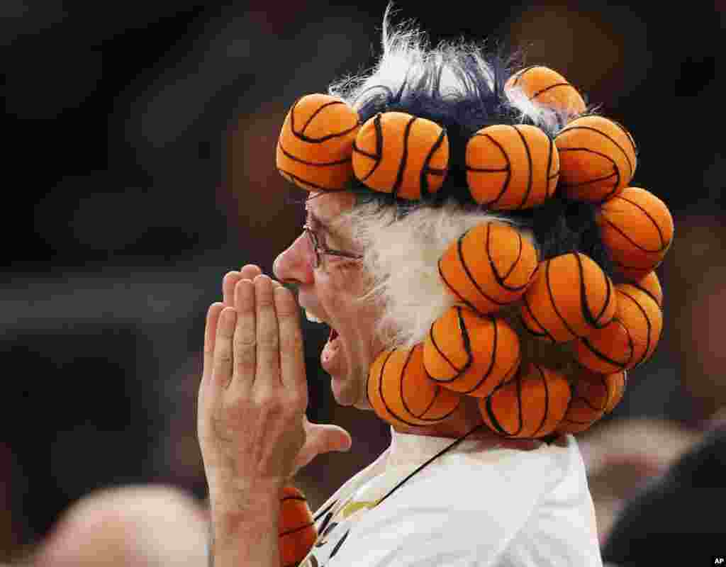 A Connecticut fan yells for his team during the second half of an NCAA college basketball game between Connecticut and Maryland at Madison Square Garden in New York, Dec. 28, 2015.