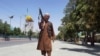 A Taliban fighter patrols inside the city of Ghazni, located in western Afghanistan, Aug. 12, 2021. 