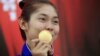 កញ្ញា​ ស៊ន សៀវម៉ី អាយុ​១៩​ឆ្នាំ បង្ហាញ​មេដាយ​មាស​របស់​កញ្ញា​ទៅ​កាន់​អ្នក​កាសែត​នៅ​ក្រោយ​សន្និសីទ​ព័ត៌មាន​មួយ​ក្នុង​ក្រុង​ភ្នំពេញ​ កាល​ពី​ថ្ងៃ​ទី​៦ ខែ​តុលា ឆ្នាំ​២០១៤។ កញ្ញា សៀវម៉ី ជា​កីឡាការិនី​ដែល​បាន​ឈ្នះ​មេដាយ​មាស​ដំបូង​បំផុត​របស់​កម្ពុជា​នៅ​ក្នុង​ការ​ប្រកួត​កីឡា​អាស៊ី Asian Games ដោយ​បាន​ឈ្នះ​នៅ​ក្នុង​វិញ្ញាសា​កីឡា​តេក្វាន់ដូ​ក្នុង​ការ​ប្រកួត​កីឡា​ Asian Games ទី​១៧​នៅ​ទី​ក្រុង​អ៊ីនឈិន​ប្រទេស​កូរ៉េ​ខាង​ត្បូង។ (REUTERS)