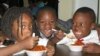Each night, chilcren at Benning Courts Learning Center in Washington, DC, receive a hot supper prepared by DC Central Kitchen. (VOA/R. Skirble) 