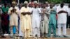 Muslims pray outside a school during celebrations marking Eid al-Adha in Lagos October 15, 2013.
