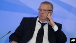 FILE - Russian lawmaker Vladimir Zhirinovsky listens to Russian President Vladimir Putin's address to members of the Crimean parliament.