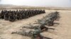 FILE - Afghan National Army soldiers carry out an exercise during a live firing at the Afghan Military Academy in Kabul, Afghanistan, Oct. 31, 2018.