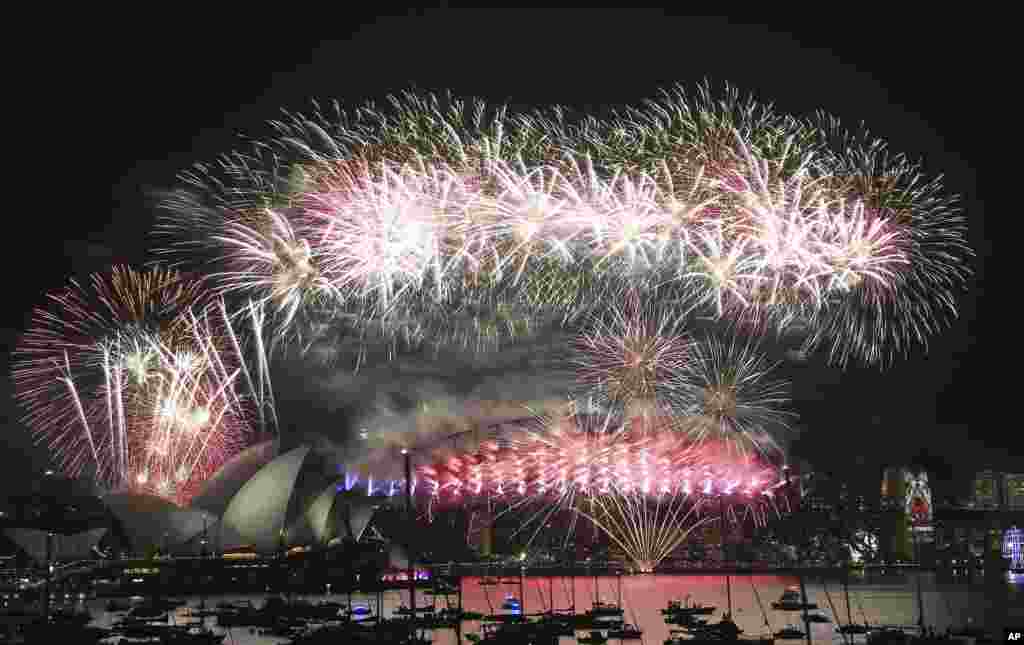 Fireworks explode over the Opera House and Harbour Bridge during a New Year&#39;s Eve fireworks display in Sydney, Australia.