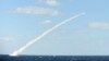 In this undated photo released by the South Korean Defense Ministry on February 14, 2013, a South Korean sea-to-land cruise missile is fired from a submarine during a drill at an undisclosed location in South Korea.