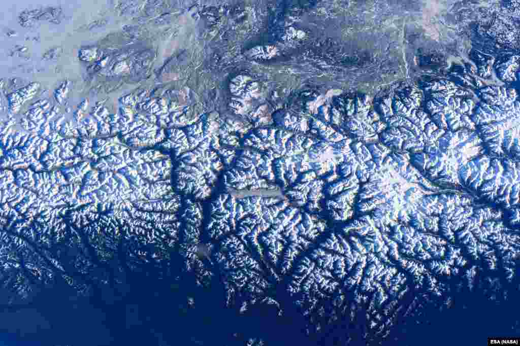 ESA astronaut Tim Peake took this photograph over the west coast of Canada from the International Space Station on Dec. 31, 2015, and shared it with his Twitter followers on Jan. 5, 2016. The photograph shows Canada&#39;s Coast Range of mountains, with King Island and Burke Channel in the center. The Pacific Ocean is visible at the bottom and north is to the left.