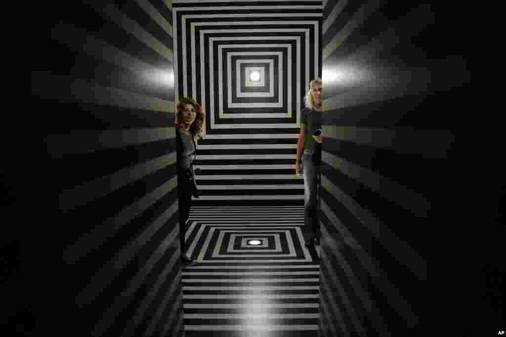 Visitors stand inside the installation &#39;Le mie prigioni&#39; (My Jails), by architect Alessandro Mendini, part of the &#39;Fuori Salone&#39; exhibitions during the Design Week, in Milan, Italy.