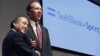 Softbank Corp President Masayoshi Son (L) shakes hands with Dan Hesse, president and CEO of the Sprint Nextel Corporation, in Tokyo, October 15, 2012. 