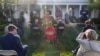 Reporters are seated a social distance apart as President Donald Trump speaks about the coronavirus in the Rose Garden of the White House, April 15, 2020, in Washington.