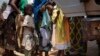 Muslim Children are lifted into a truck that had fallen into a ditch while turning around in Bangui, Central African Republic, Friday, Feb. 14, 2014. 