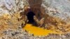 Yellow mine waste water is seen at the entrance to the Gold King Mine in San Juan County, Colorado, August 5, 2015.