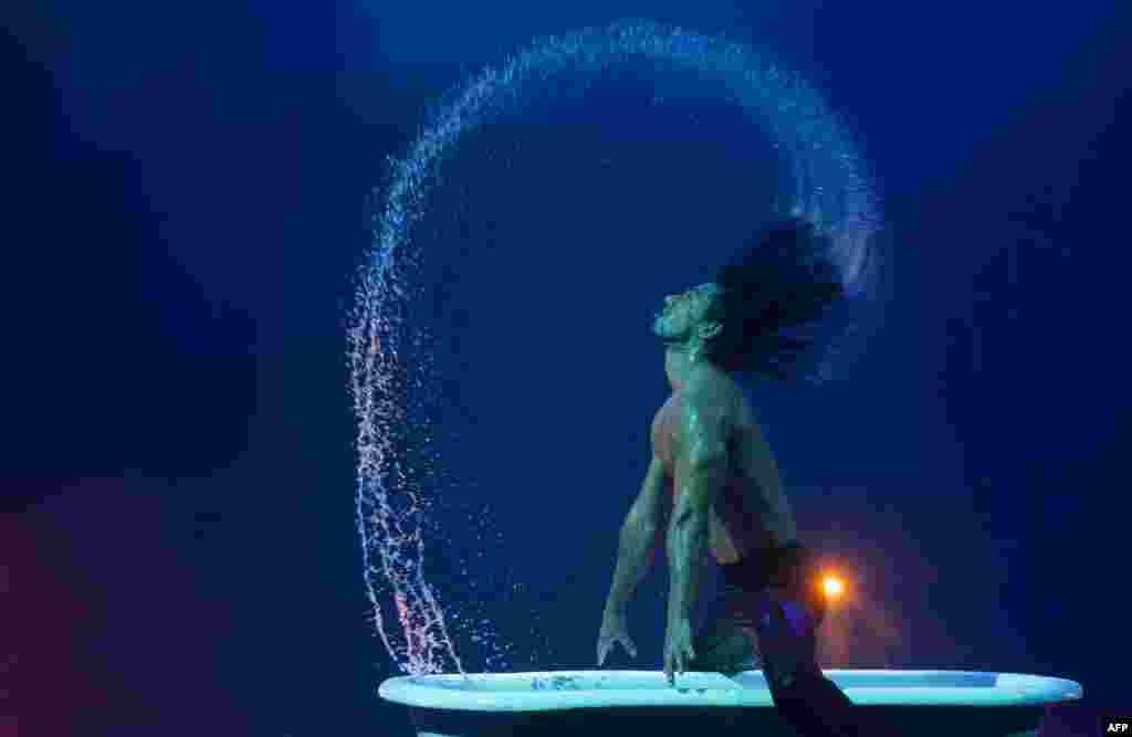 An acrobat performs during a press rehearsal of the new musical show &quot;The Hole X&quot; in Madrid, Spain.