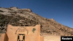 FILE - A view of ground zero at the French nuclear tests' site in In-Ekker near Ain Maguel, 170 km (106 miles) from the southern Algerian town of Tamanrasset, Feb. 16, 2007.