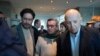 FILE - Pablo Beltran, center, commander and chief negotiator for the rebel National Liberation Army, ELN, Ivan Cepeda, left, and Jose Otty Patiño, negotiators for the Colombian government, at peace talks in Bogota, Colombia, Oct. 10, 2023.
