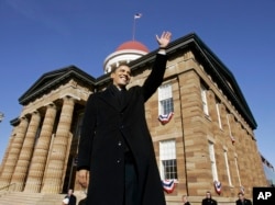 FILE - Then-U.S. Sen. Barack Obama, D-Ill., waves to spectators as he arrives to announce his candidacy for president of the United States at the Old State Capitol in Springfield, Ill., Feb. 10, 2007.