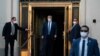FILE - President Donald Trump walks out of Walter Reed National Military Medical Center after receiving treatment as a COVID-19 patient, in Bethesda, Maryland, Oct. 5, 2020.