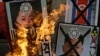 South Korean protesters burn the pictures of North Korean leader Kim Jong Un during an anti-North Korea rally following a nuclear test conducted by North Korea, in Seoul, South Korea, February 12, 2013. 
