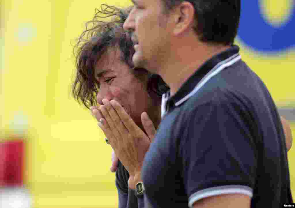 A relative of one of the victims of the train crash reacts in Santiago de Compostela, northwestern Spain, July 25, 2013.&nbsp;