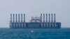 A floating power station waits off the coast at Jiyeh, south of Beirut, Lebanon, July 16, 2018.