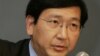 FILE - Professor Johannes M. Chan addresses the media during a press conference