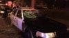 A police car with broken windows is seen in this photograph released by the Milwaukee Police Department after disturbances following the police shooting of a man in Milwaukee, Wisconsin, Aug. 13, 2016.