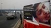 FILE - An anti-tobacco warning is seen on a road divider on the outskirts of New Delhi, India, Nov. 4, 2016.
