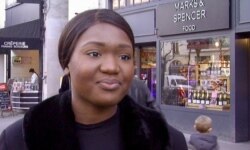 Student Adolphine Nsimba exits a Paris M&S food store, one of Britain's many marks on Europe. (Lisa Bryant/VOA)