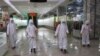 FILE - Staff of the Pyongyang Department Store No. 1 disinfect the store to help curb the spread of the coronavirus before it opens in Pyongyang, North Korea, Dec. 28, 2020. 