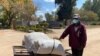 FILE - Aleck Mugopa, 52, pictured July 30, 2020, in Harare, says that since the beginning of the lockdown in Zimbabwe, there are times when his family has gone without a decent meal. (Columbus Mavhunga/VOA)