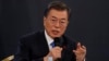 South Korean President Moon Jae-in answers reporters' question during his New Year news conference at the Presidential Blue House in Seoul, South Korea, Jan. 10, 2018.
