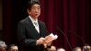 Japan's Prime Minister Shinzo Abe delivers a speech during the graduation ceremony of the National Defense Academy in Yokosuka, Kanagawa prefecture, Japan, March 18, 2018.