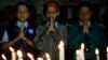 India schoolgirls offer prayers for victims killed in a Taliban attack on a Pakistan military-run school, in Mumbai, India, Dec. 17, 2014. 