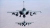 FILE - Jet fighters fly over Iraq in November 2014. 