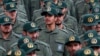 FILE - Iranian Revolutionary Guard members attend a ceremony celebrating the 40th anniversary of the Islamic Revolution, at the Azadi, or Freedom, Square in Tehran, Iran, Feb. 11, 2019.