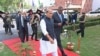 Indian Defense Minister Rajnath Singh walks with visiting U.S. Defense Secretary Lloyd Austin before reviewing an honor guard in New Delhi, March 20, 2021.