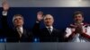 Президент МОК Томас Бах, президент Росії Володимир Путін, золотий медаліст із бобслею Александр Зубков на Олімпіаді в Сочі
